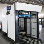 Industrial press with a sheet feeding system